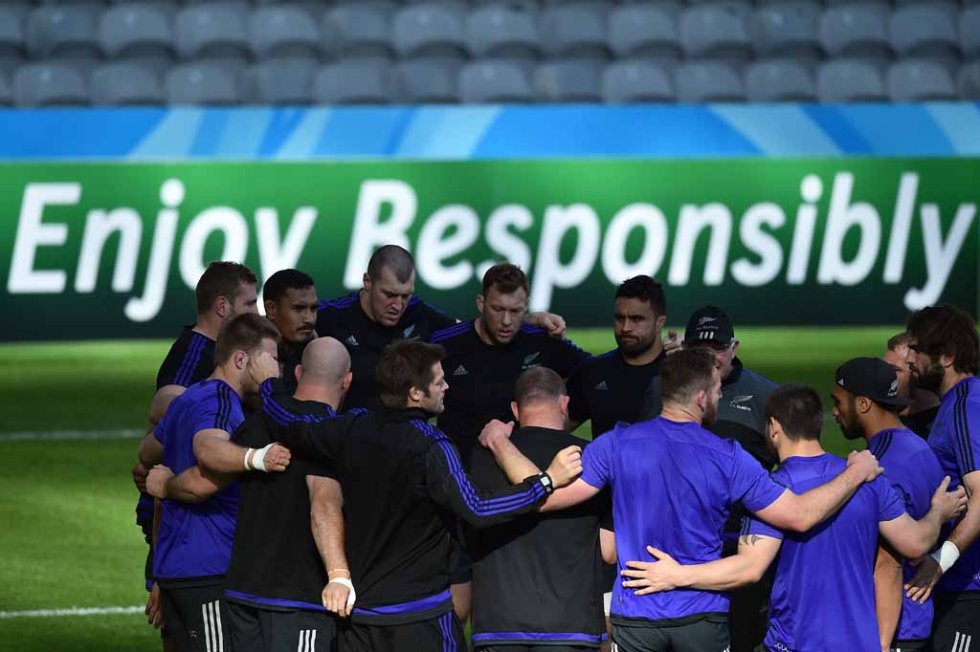 All Blacks huddle at the end of a training session. All Blacks huddle at the end of a training session.