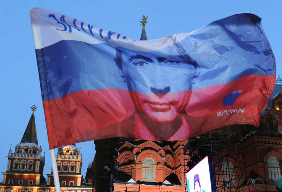 A Russian flag with Vladimir Putin's image flies above his supporters during a Moscow rally in 2012. A Russian flag with Vladimir Putin's image flies above his supporters during a Moscow rally in 2012.