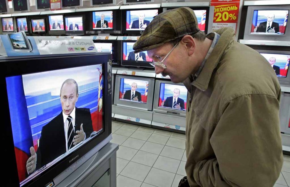 A man watches President Vladimir Putin's annual address to the nation in October 2006. A man watches President Vladimir Putin's annual address to the nation in October 2006.