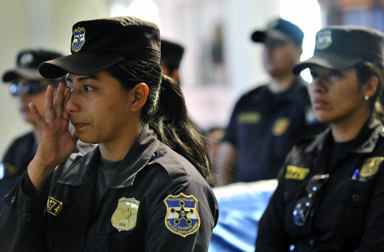 Police attend the funeral of a colleague killed by a gang member, in Zacatecoluca east San Salvador on April 22, 2015 Police attend the funeral of a colleague killed by a gang member, in Zacatecoluca east San Salvador on April 22, 2015