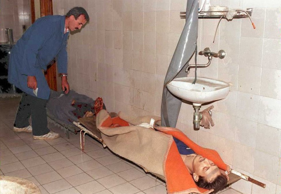A Sarajevo morgue worker checks the identification tags of shelling victims on June 16, 1995 A Sarajevo morgue worker checks the identification tags of shelling victims on June 16, 1995