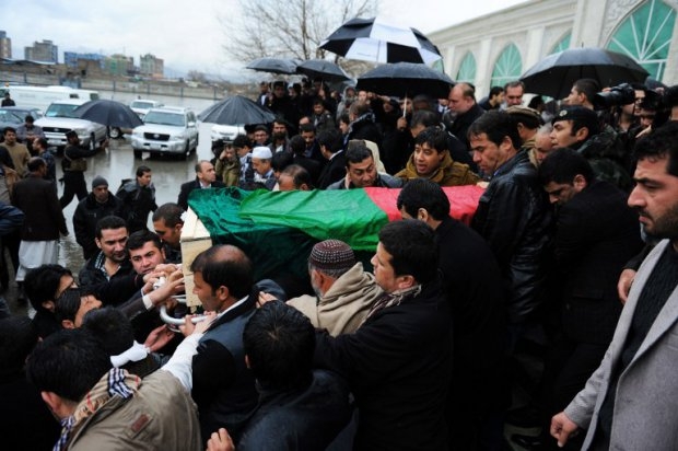 Friends and family of Afghan AFP reporter Sardar Ahmad carry his casket as they leave a mosque and head to the cemetery during his funeral in Kabul on March 23, 2014 Friends and family of Afghan AFP reporter Sardar Ahmad carry his casket as they leave a mosque and head to the cemetery during his funeral in Kabul on March 23, 2014