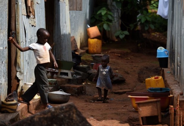 Children play outside their house in Lester Road, Freetown, on November 7, 2014 Children play outside their house in Lester Road, Freetown, on November 7, 2014