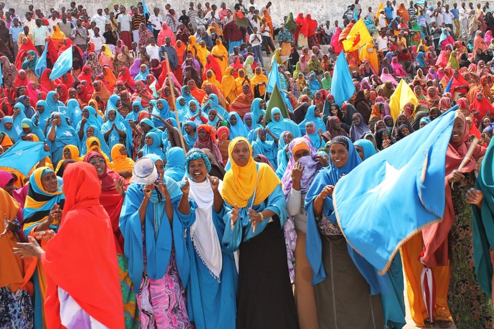Somali women wave their national flag at Konis stadium in Mogadishu during a ceremony marking the anniversary of Somalia’s independence on July 1, 2012 Somali women wave their national flag at Konis stadium in Mogadishu during a ceremony marking the anniversary of Somalia’s independence on July 1, 2012