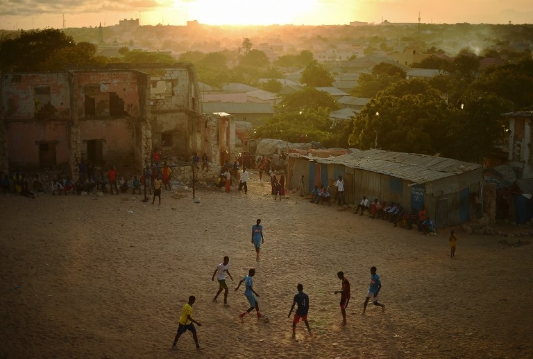 Somalis play football as the sun sets in Mogadishu on March 24, 2015 Somalis play football as the sun sets in Mogadishu on March 24, 2015