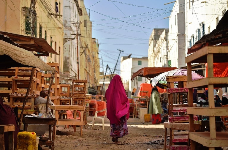 A woman walks through Hamar Weyne district in South Mogadishu on March 25, 2015 A woman walks through Hamar Weyne district in South Mogadishu on March 25, 2015