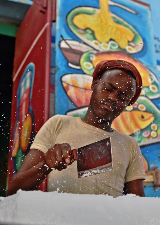 A man cuts blocks of ice in Mogadishu on March 26, 2015 A man cuts blocks of ice in Mogadishu on March 26, 2015