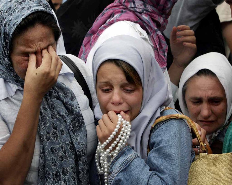 Bosnian Muslim women cry during a funeral of the remainds of their relative, victum of the Srebrenica massacre in the village of Potocari, 11 July 2005 Bosnian Muslim women cry during a funeral of the remainds of their relative, victum of the Srebrenica massacre in the village of Potocari, 11 July 2005