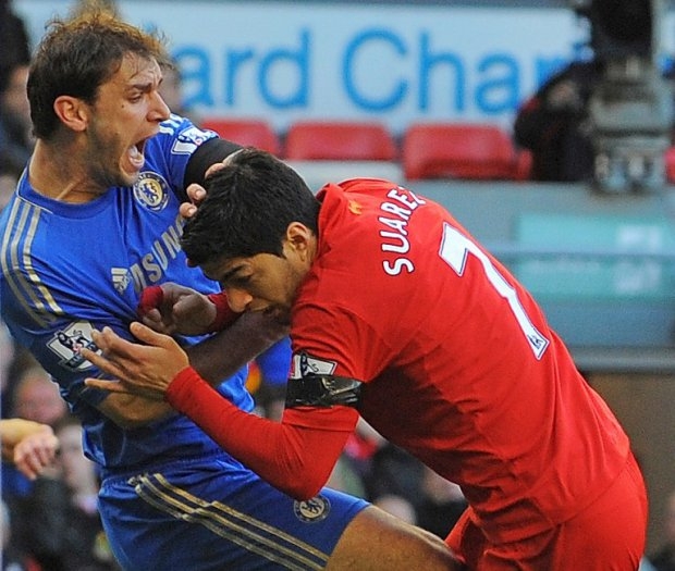 Luis Suarez bites Chelsea defender Branislav Ivanovic in April 2014 Luis Suarez bites Chelsea defender Branislav Ivanovic in April 2014