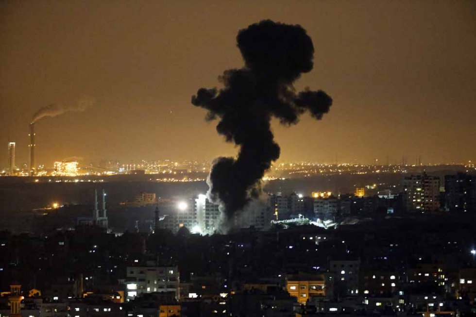 Smoke rises over Gaza after an Israeli strike. July, 2014. Smoke rises over Gaza after an Israeli strike. July, 2014.