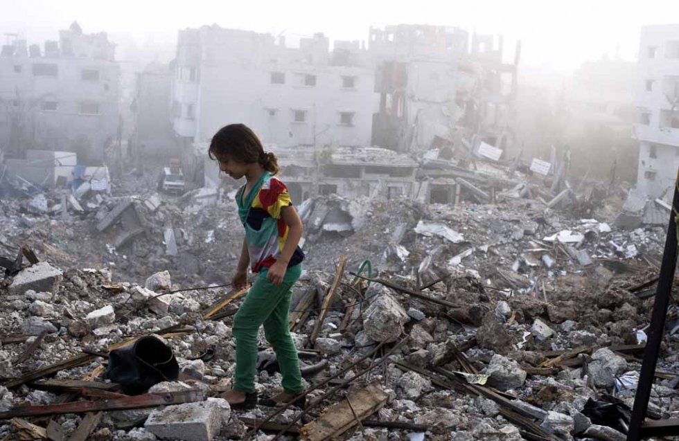 A child walks through the rubble her home in Gaza. August, 2014. A child walks through the rubble her home in Gaza. August, 2014.