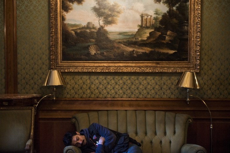 A journalist naps after Iran nuclear program talks extend into the early morning at the Beau Rivage Palace Hotel in Lausanne, Switzerland, on April 1, 2015 A journalist naps after Iran nuclear program talks extend into the early morning at the Beau Rivage Palace Hotel in Lausanne, Switzerland, on April 1, 2015