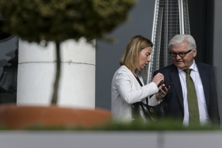 EU foreign policy chief Federica Mogherini and German Foreign Minister Frank-Walter Steinmeier seen during a break in talks at the Beau Rivage on April 1, 2015 EU foreign policy chief Federica Mogherini and German Foreign Minister Frank-Walter Steinmeier seen during a break in talks at the Beau Rivage on April 1, 2015