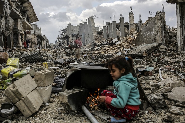 Kurdish Syrian girls among destroyed buildings in Kobane on March 22, 2015. Kurdish Syrian girls among destroyed buildings in Kobane on March 22, 2015.