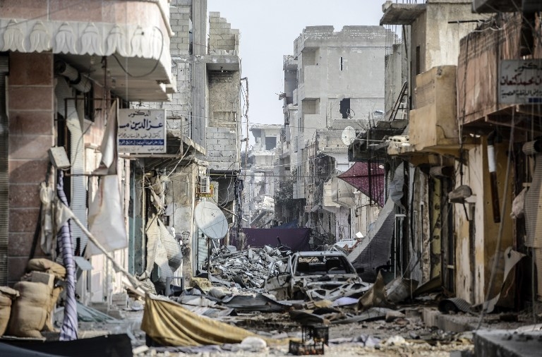 Wreckage left by fighting on a street in Kobane, Syria, on January 28, 2015 Wreckage left by fighting on a street in Kobane, Syria, on January 28, 2015