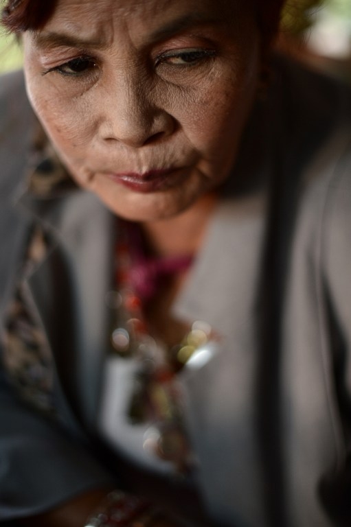 A fortune teller at a Bangkok shrine to 'Nak' on January 15, 2015 A fortune teller at a Bangkok shrine to 'Nak' on January 15, 2015