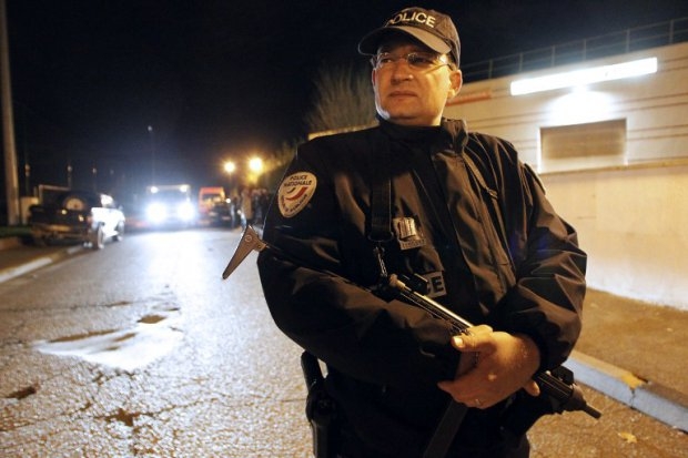 A policeman stands guard as police and firefighters hunt for what was feared to be a tiger on the loose in Montevrain, near Paris on November 13, 2014 A policeman stands guard as police and firefighters hunt for what was feared to be a tiger on the loose in Montevrain, near Paris on November 13, 2014