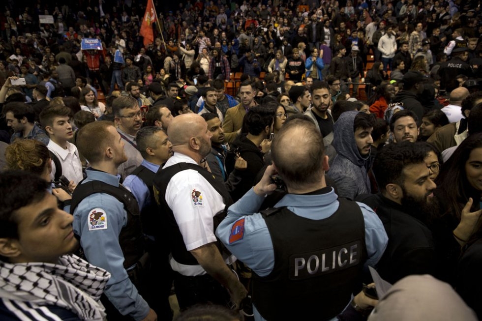 Trump supporters and protesters confront each other in Chicago. Trump supporters and protesters confront each other in Chicago.