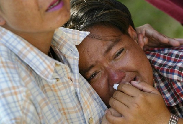 A Thai woman cries after identifying her husband's body at Patong morgue on December 27, 2004 A Thai woman cries after identifying her husband's body at Patong morgue on December 27, 2004