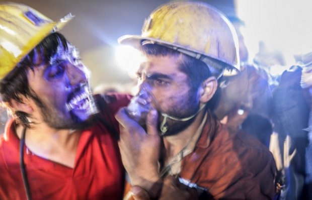 A miner celebrates seeing his friend emerge alive after the Soma mine blast on May 13, 2014 A miner celebrates seeing his friend emerge alive after the Soma mine blast on May 13, 2014