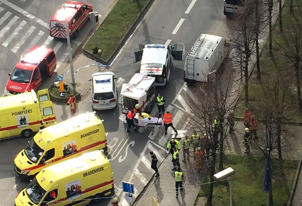 Rescue teams evacuate wounded people outside the Maalbeek metro station Rescue teams evacuate wounded people outside the Maalbeek metro station