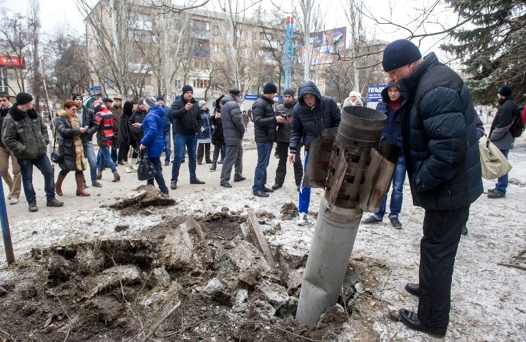An unexploded missile is embedded in a street of Kramotorsk on February 10, 2015 An unexploded missile is embedded in a street of Kramotorsk on February 10, 2015