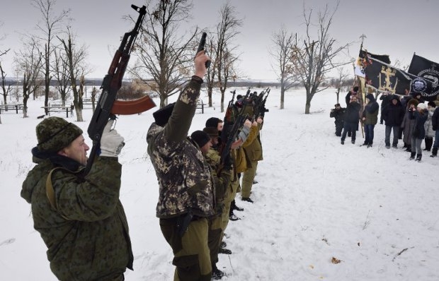 Donetsk People's Republic fighters fire in the air at the Savur-Mogyla memorial in eastern Ukraine Donetsk People's Republic fighters fire in the air at the Savur-Mogyla memorial in eastern Ukraine