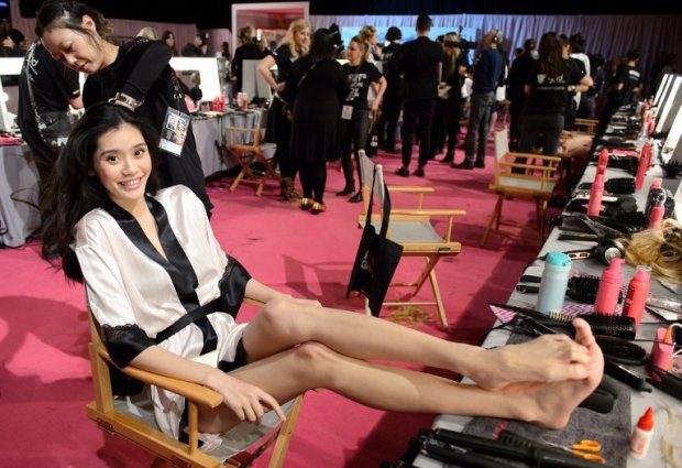 Chinese model Ming Xi backstage at the 2014 Victoria's Secret Fashion Show in London Chinese model Ming Xi backstage at the 2014 Victoria's Secret Fashion Show in London