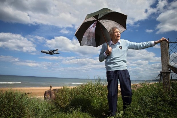 Bernard Dargols on Omaha Beach, June 5, 2014, as a Hercules plane flies by. Bernard Dargols on Omaha Beach, June 5, 2014, as a Hercules plane flies by.
