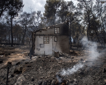 A photo shows a burned house following a wildfire at the village of Neos Voutzas, near Athens, on July 24, 2018. 