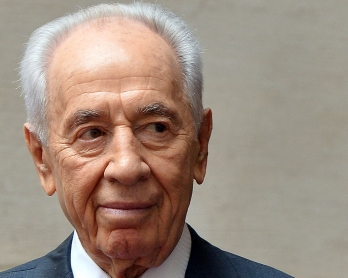Israeli President Shimon Peres is pictured as he is welcomed by Italian Prime Minister at Chigi Palace in Rome on April 30, 2013