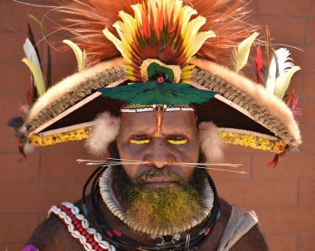 A local tribesman waits to see China's President Xi Jinping during his visit to the Butuka Academy school in Port Moresby on November 16, 2018, ahead of the Asia-Pacific Economic Cooperation (APEC) summit.
