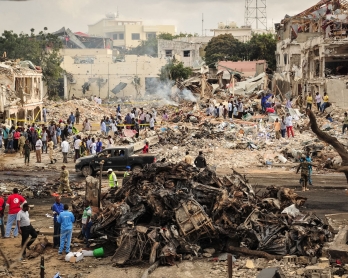 / A picture taken on October 15, 2017 shows a general view of the scene of the explosion of a truck bomb in the centre of Mogadishu.