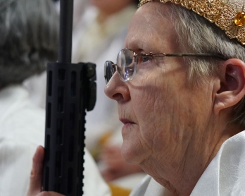 Worshippers at World Peace and Unification Sanctuary hold weapons during their service February 28, 2018 in Newfoundland, Pennsylvania.