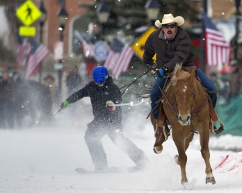 Rider Jorge Calzadillas races down Harrison Avenue while towing a skier during the 68th annual Leadville Ski Joring weekend competition on March 5, 2017 in Leadville, Colorado. 