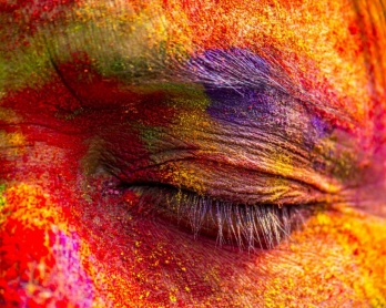 An Indian woman's face is smeared with colored powder during celebrations of the Holi festival in the Sivasagar district of northeastern Assam state on March 6, 2015 (AFP PHOTO)