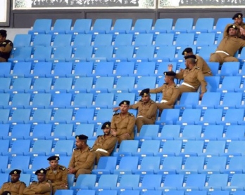 Saudi police sit in the stands during the 22nd Gulf Cup football tournament at the Prince Faisal bin Fahd Stadium in Riyadh on November 25, 2014 (AFP PHOTO/ FAYEZ NURELDINE)