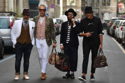 MILAN, ITALY - JANUARY 13, 2019: Man with Louis Vuitton bag and green scarf  before Reshake fashion show, Milan Fashion Week street style Stock Photo -  Alamy